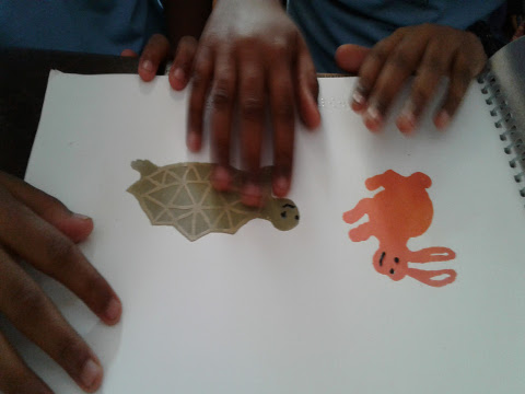 Two children explore ‘Hopsy and Topsy’ - an accessible tactile story book